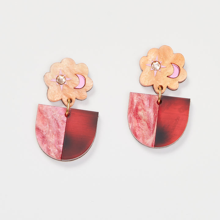 Orange and Pink earrings on a white back ground. 