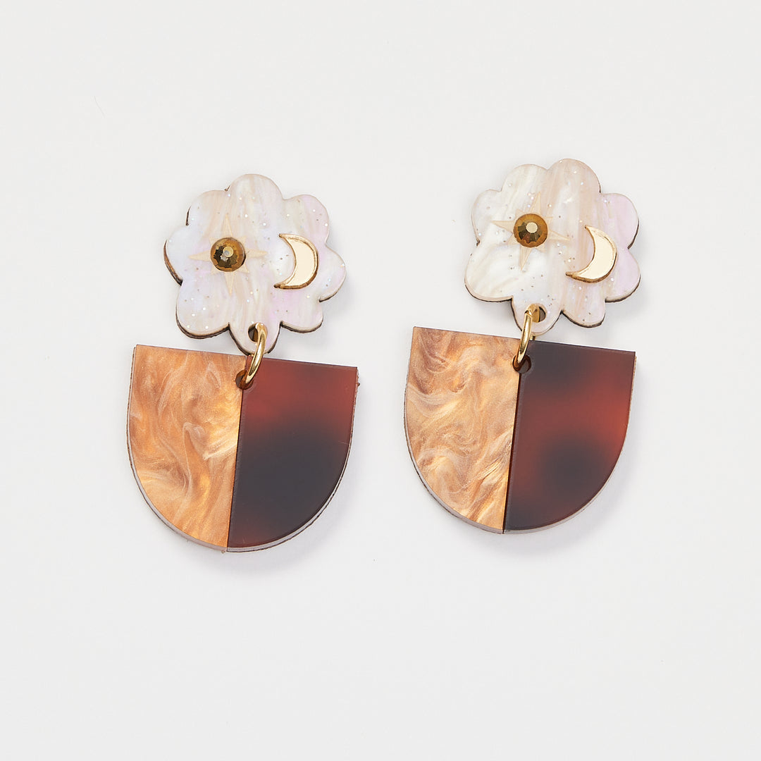 Brown. Tortoise Shell earrings with moon and star details