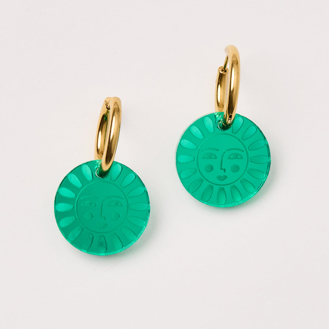 laser cut acrylic flower charm earrings with a face hang in green mirror